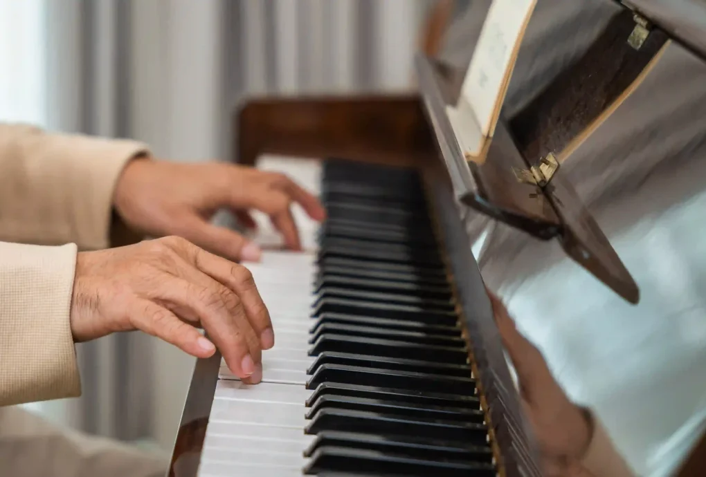 hands-playing-an-elegant-piano-in-a-home-2026-09-21-21-47-04-utc